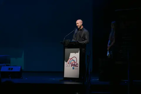 A speaker at the podium during the AFIN Awards Night ceremony.