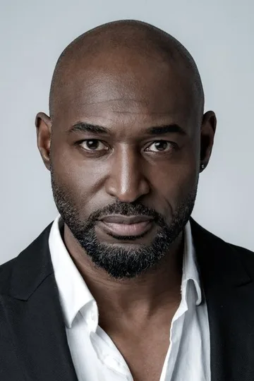 Adrian Holmes, portrait via TMDB.